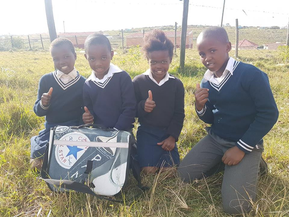 Isiseko Students Using Ground as Writing Surface